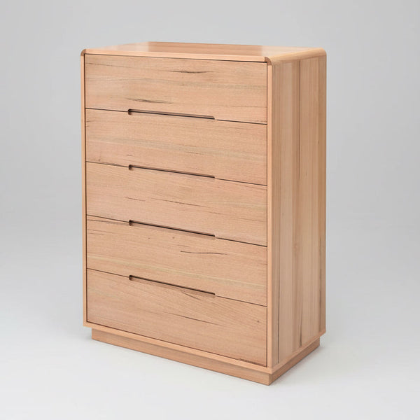 Light wood dresser cabinet with four drawers and bar pulls
