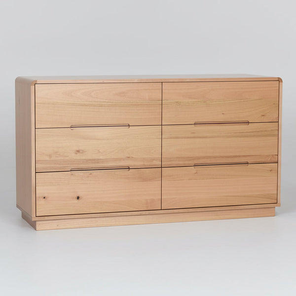 Light wood double dresser with four drawers and two lower round knobs