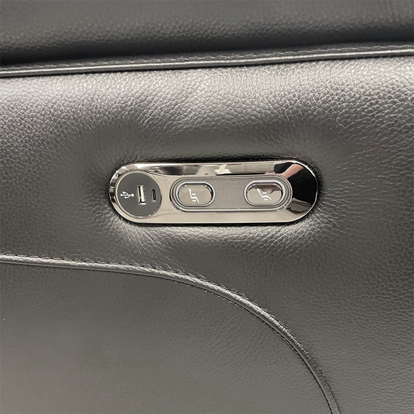 Dark arm control panel with buttons for electric recline on upholstered sofa