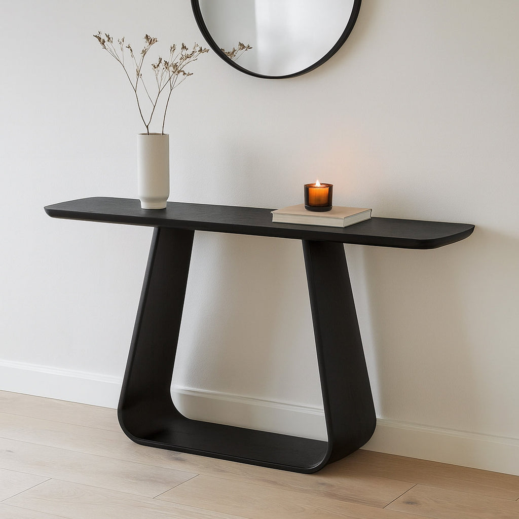 Black oak console table with dark finish, curved pedestal base and angled legs