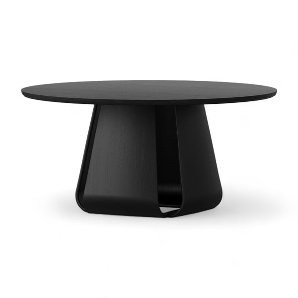 Black round dining table with pedestal base