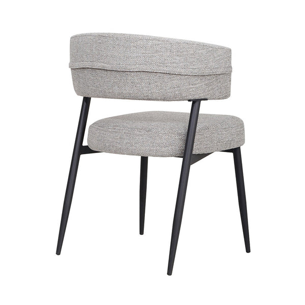 Light gray upholstered dining chair with rounded back and black tapered legs