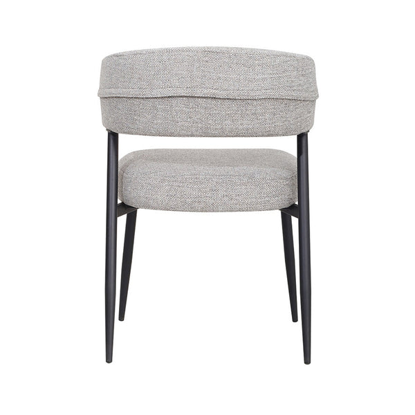 Light gray upholstered dining chair with thick cushioned seat and rounded back
