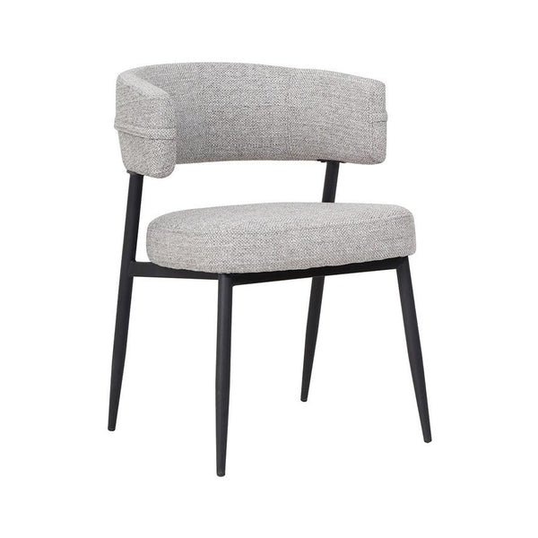 Light gray upholstered dining chair with curved armrests and black legs