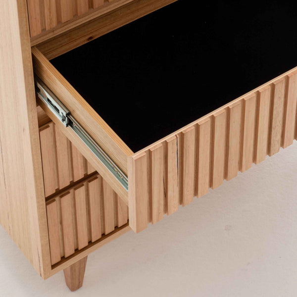 Wood platform bed base with lift-up storage and slatted interior, turned legs
