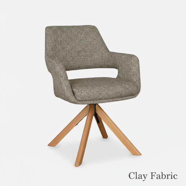 Gray upholstered dining chair with light wood tripod legs and curved back