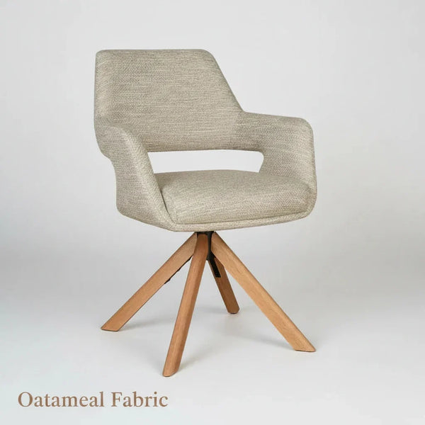 Beige upholstered dining chair with light wood legs and curved back