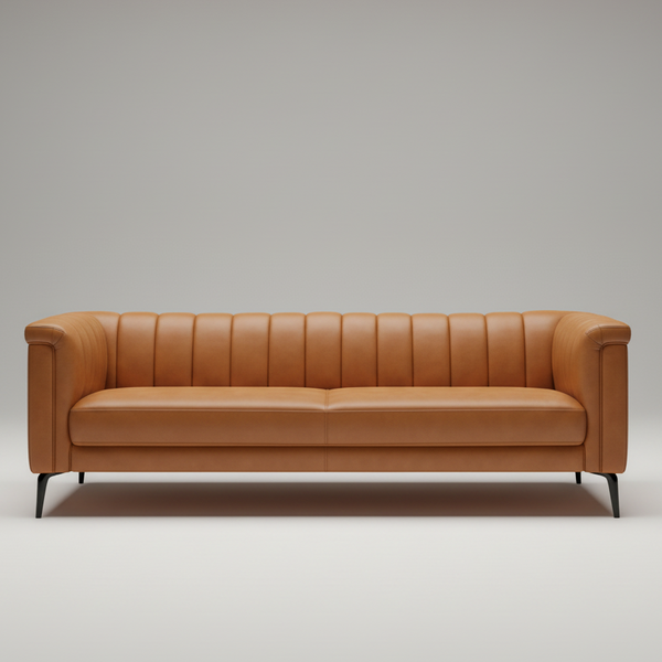 Cognac leather sofa front view with vertical channel-tufted back, padded seat, and dark legs.