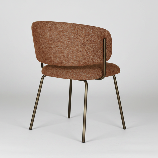A modern dining chair with a textured brown fabric upholstered seat and curved backrest, supported by slim dark metal legs, shown against a plain white background.