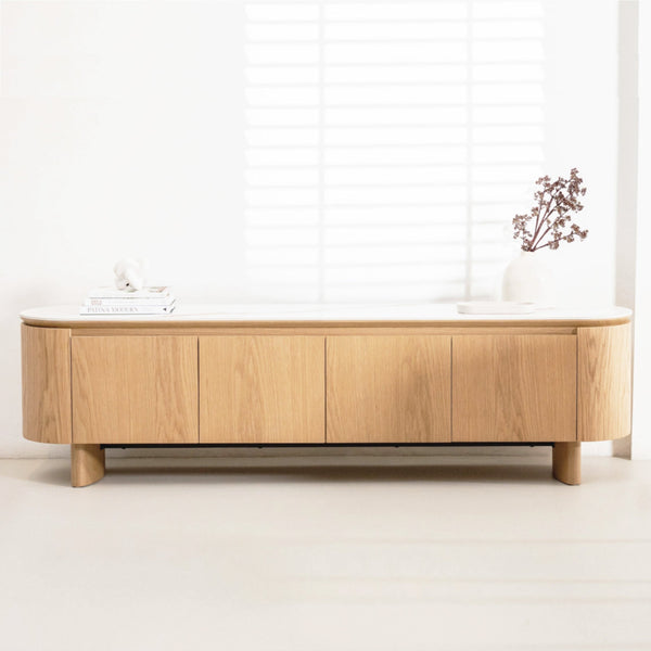 Low wood accent console table with multiple drawer fronts and short turned legs