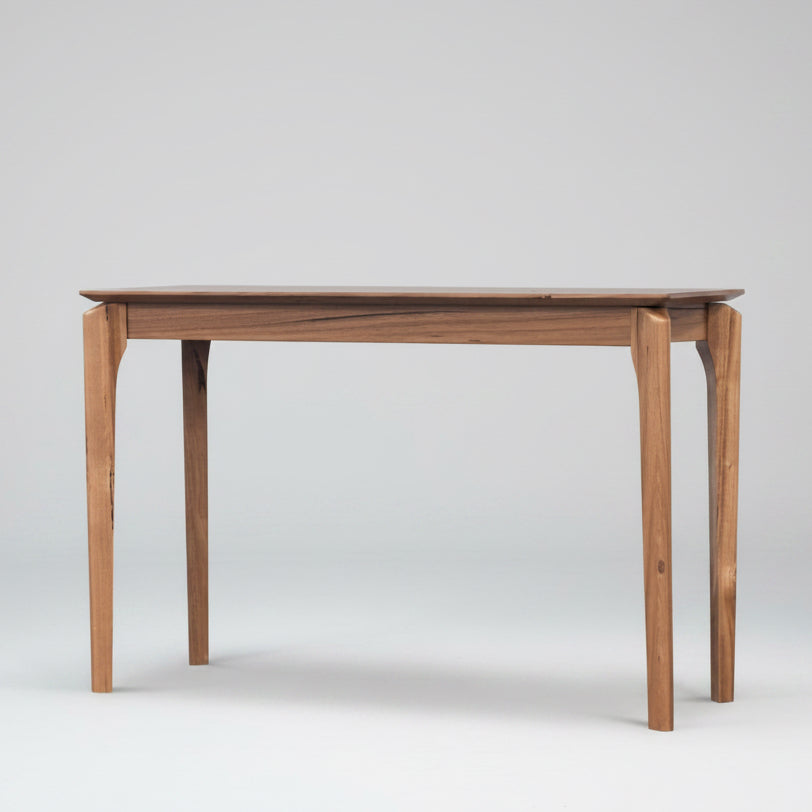 Wooden dining table on a white background