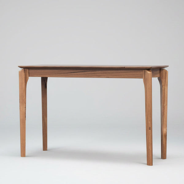 Wooden dining table on a white background
