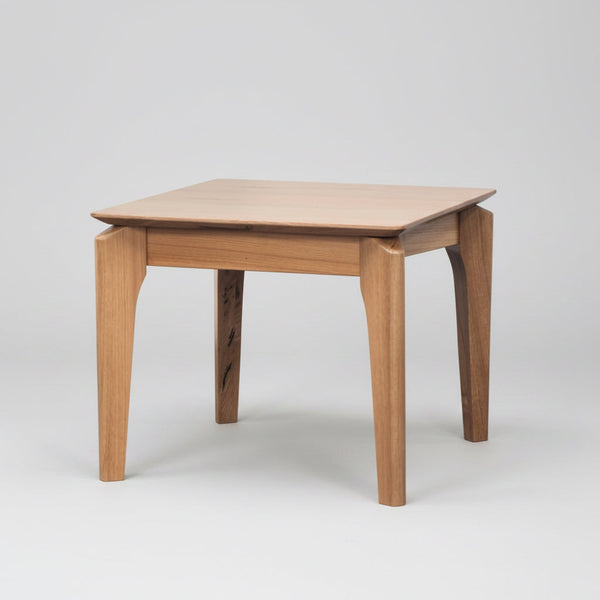 Tasmanian oak coffee table with flat top and four tapered legs.
