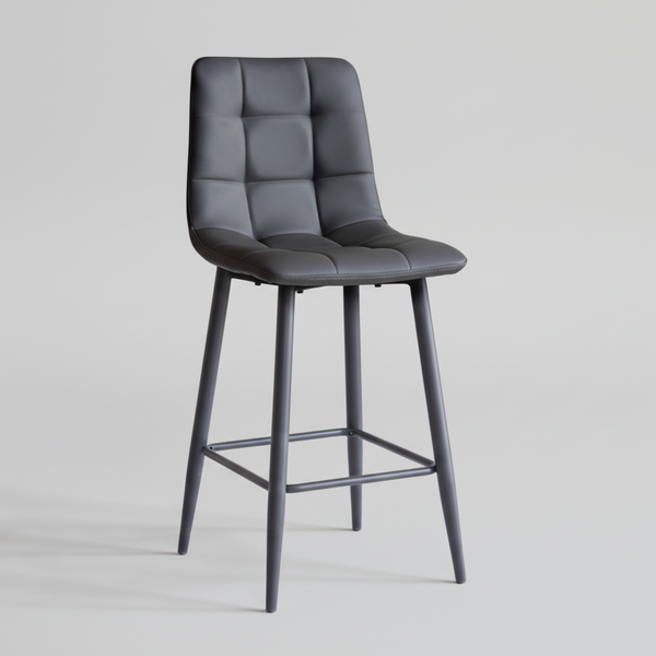Macy bar stool with dark grey quilted upholstery, padded seat, metal legs and lower footrest