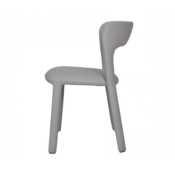 Grey upholstered dining chair, side view with padded seat and curved backrest.