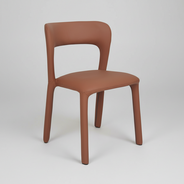 Tan upholstered dining chair with rounded backrest and seat, tapered wooden legs