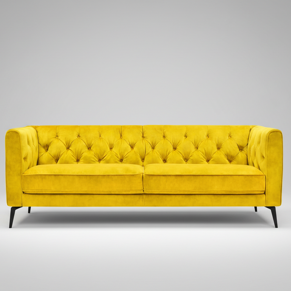 Yellow tufted sofa on a white background