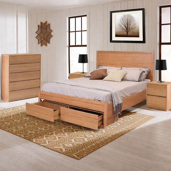 Wooden bedroom set with bed, dresser, and nightstands in a room with a tree painting on the wall.