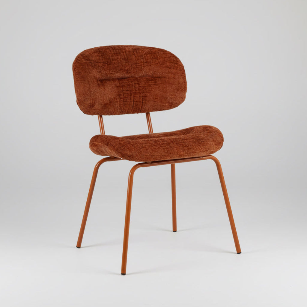 Brown fabric dining chair with rounded back and seat, tapered metal legs
