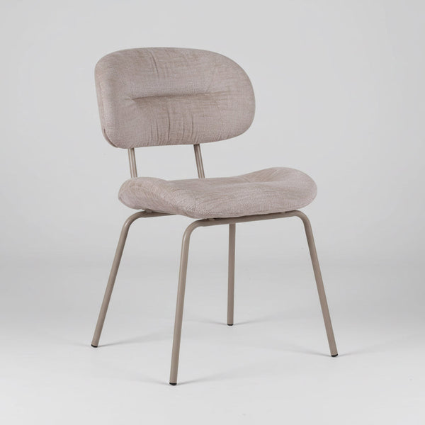 Pearl fabric dining chair with rounded backrest and cushioned seat, metal legs, angled view