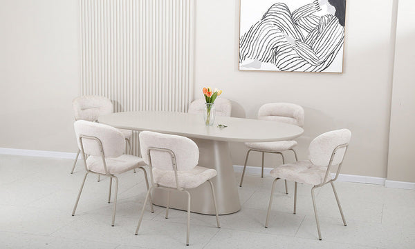 Group of pearl fabric dining chairs with rounded backs, curved seats, and metal frames