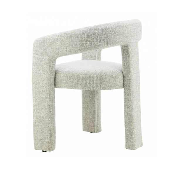 Dining chair in natural fabric with wide curved back and tapered legs.