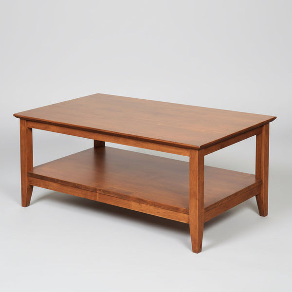 Wooden coffee table with a shelf on a white background