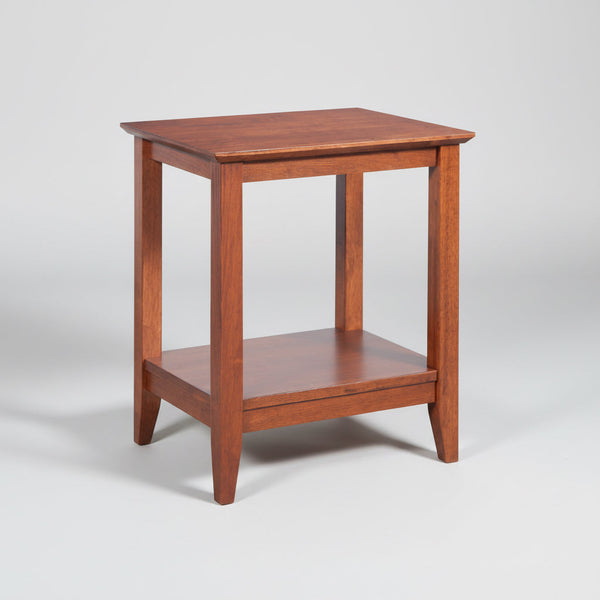 Wooden side table with a shelf on a white background