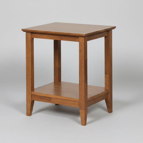 Wooden side table with a shelf on a gray background