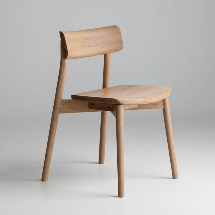 Wood dining chair with solid seat, curved backrest, angled legs