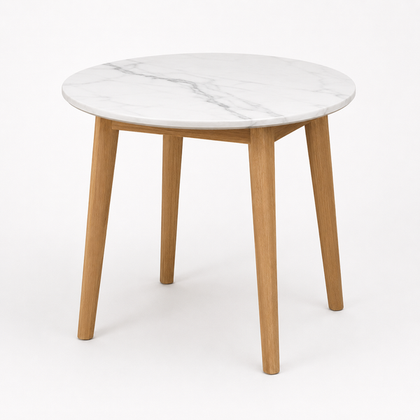 Round dining table with white marble-look tabletop and straight light wood legs