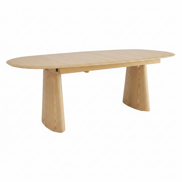 Oval extension dining table with light wood top and curved pedestal base