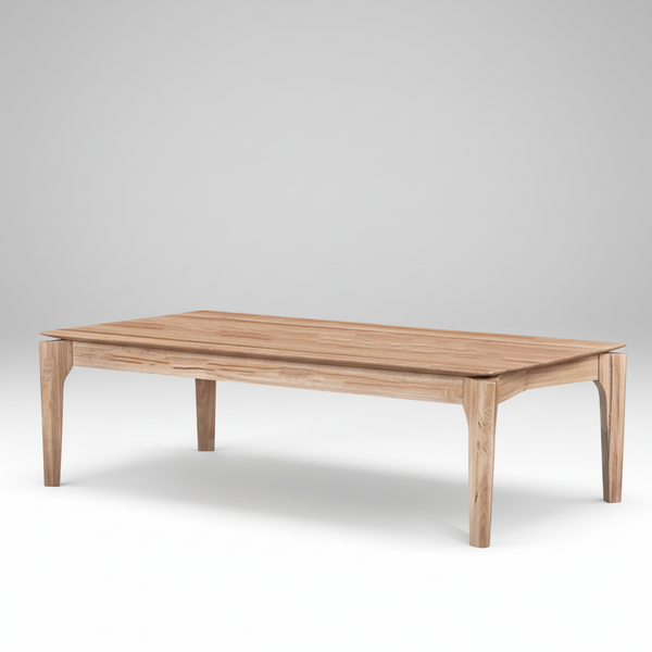Light wood coffee table with smooth rectangular top and four tapered legs.
