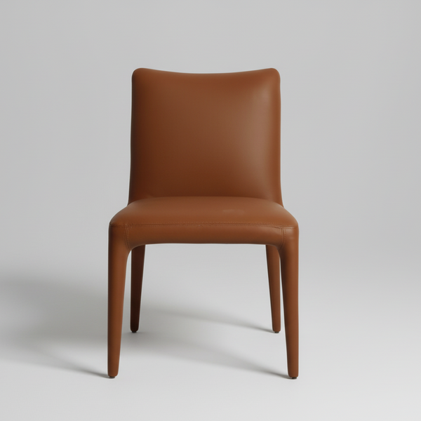 Tan upholstered dining chair with rounded back and padded seat, tapered legs