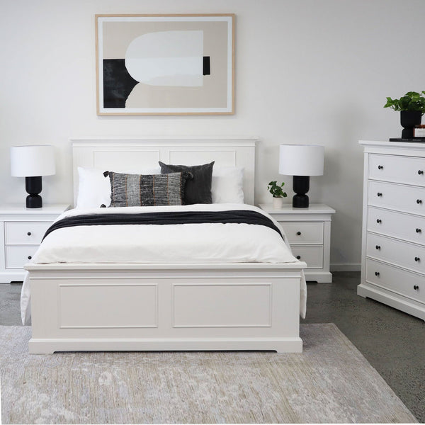 White paneled bed frame with headboard and footboard, queen/king size