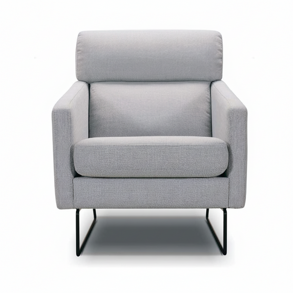 Light gray upholstered accent chair with rounded back cushion and black metal legs.