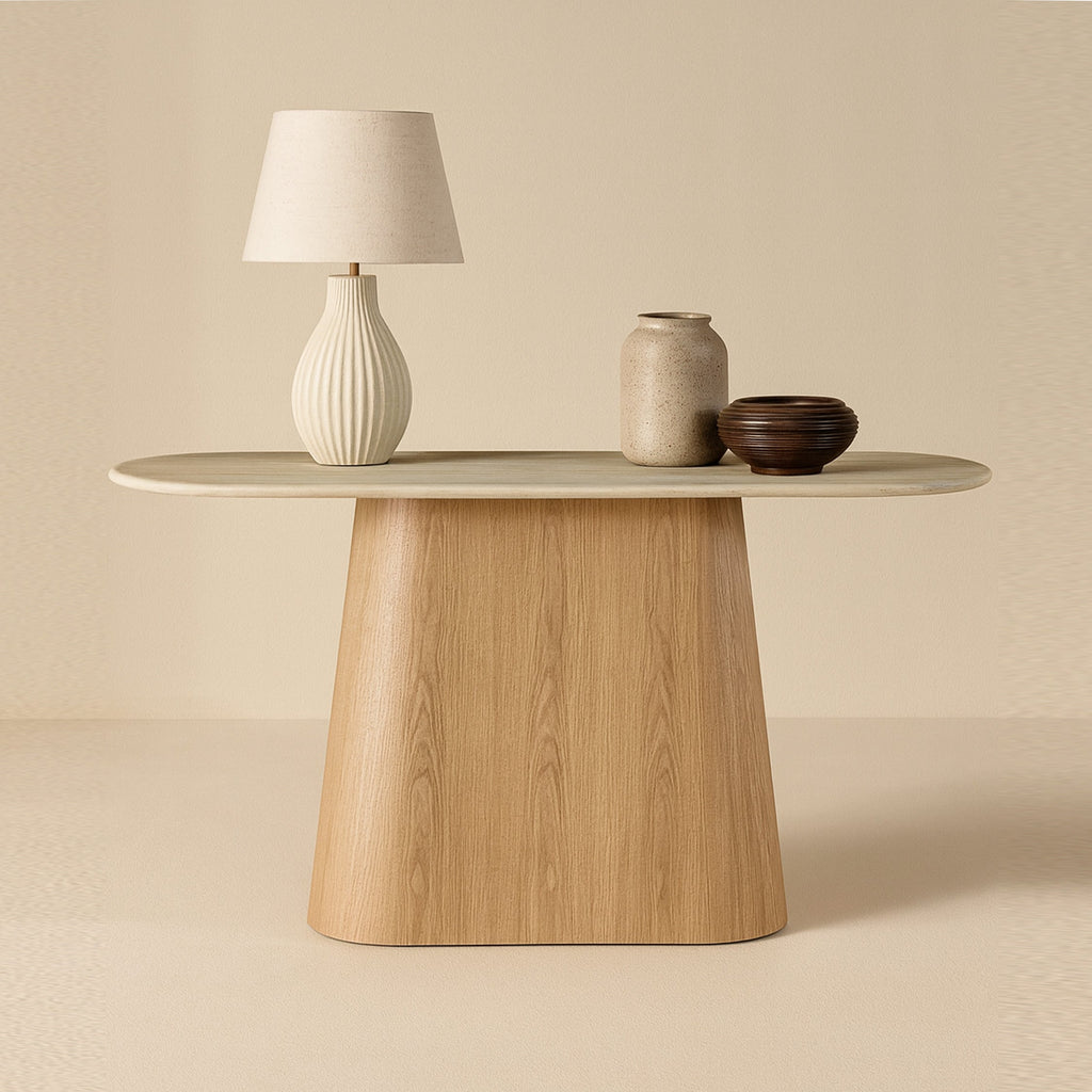 Light wood console table with round top and pedestal base.