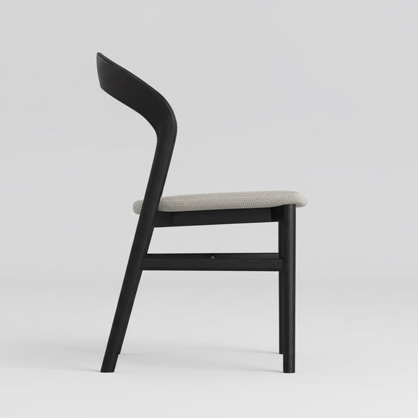 Black willow dining chair with textured light fabric seat