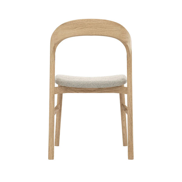 Natural oak dining chair with curved back, slatted frame, and light gray upholstered seat