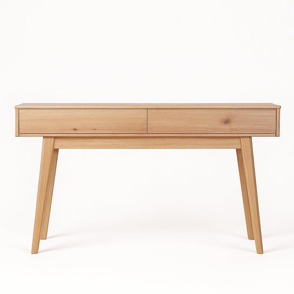 Light wood coffee table with drawer-style panel on front and tapered legs.