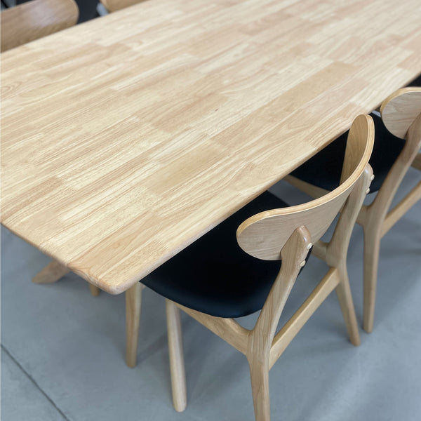 Natural wood extension dining table top with smooth edge and tapered legs