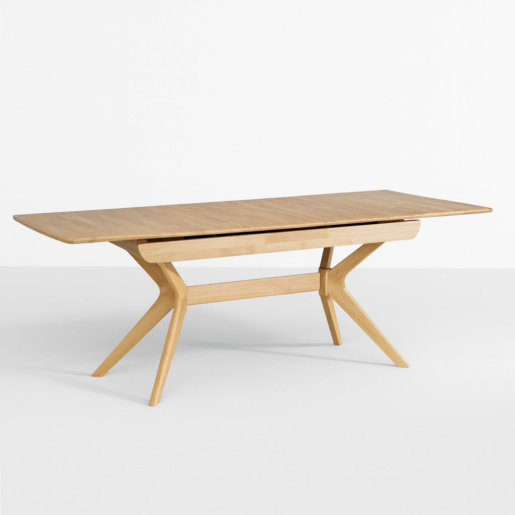 Light wood extension dining table with rectangular top and angled legs